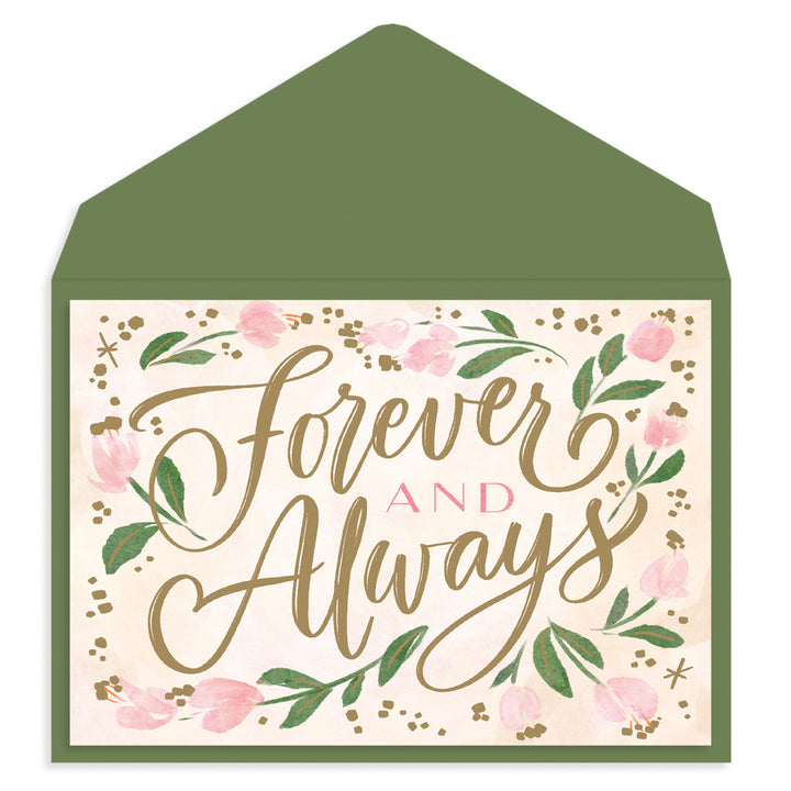 A square greeting card with a green envelope behind it. The card has a cream background with pink flowers, green leaves, and metallic gold script reading 'Forever and Always'.