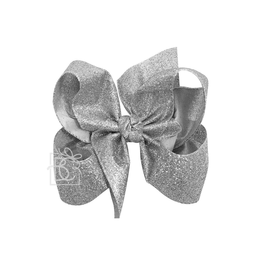 Silver glittery bow on a white background