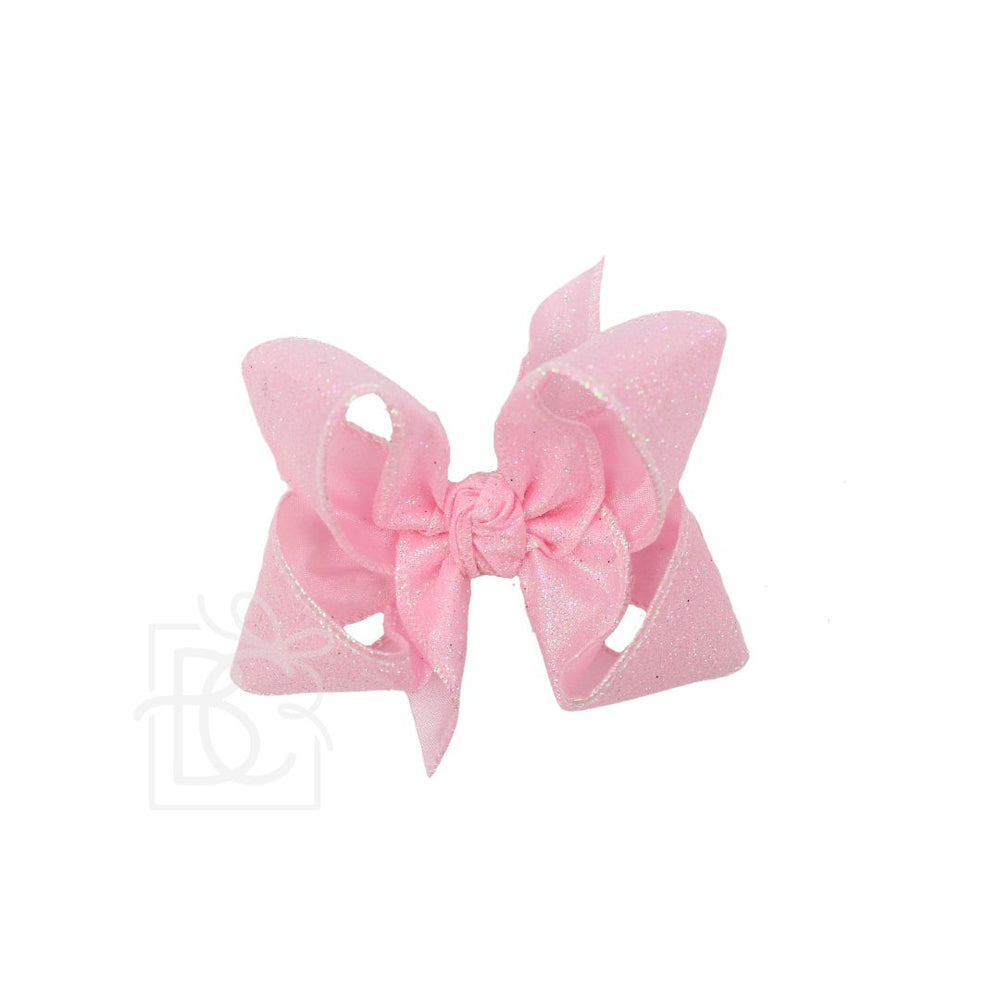 Pink bow hair clip on a white background