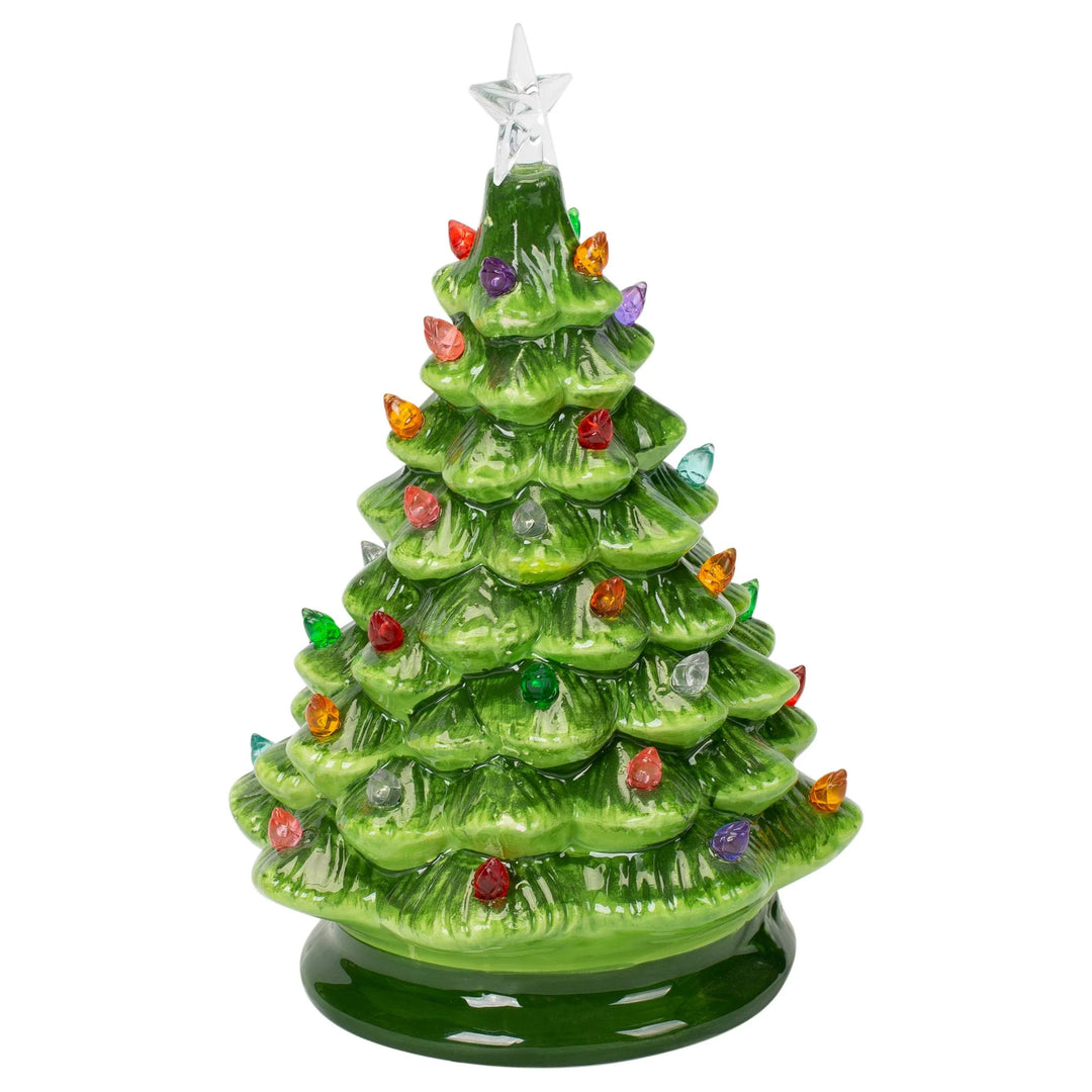 Decorative Christmas tree figurine with colorful lights on a white background