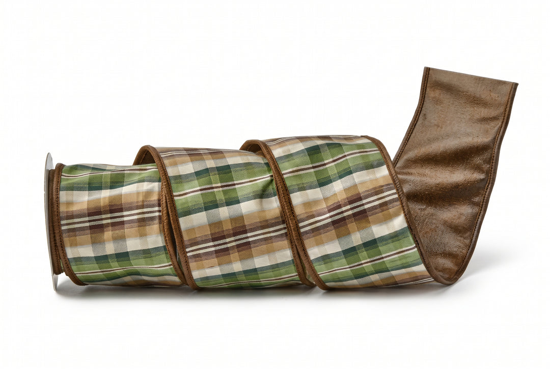 A rolled-up plaid blanket or throw in green, brown, beige, and white tones, with a solid brown reverse side, shown on a clean white background.