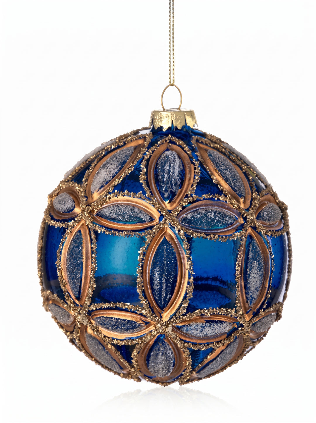 A decorative glass Christmas ornament with a cobalt blue and gold geometric pattern, hanging from a gold cap with a string against a white background.