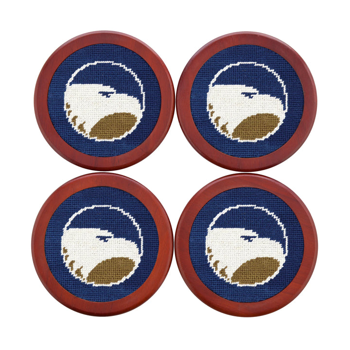 Four coasters with embroidered bald eagle design on a blue background