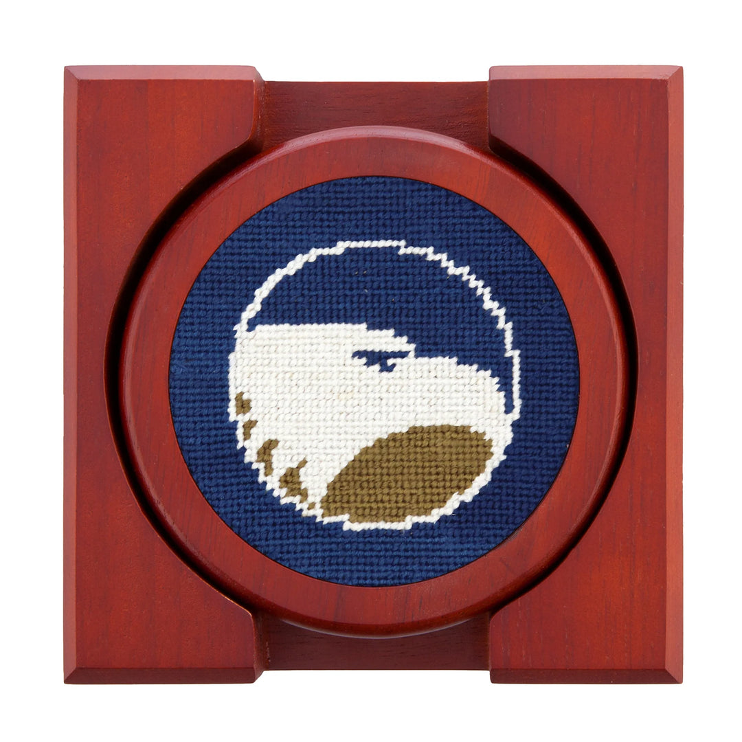 Coaster set with cross-stitched design of a golf ball in a wooden frame