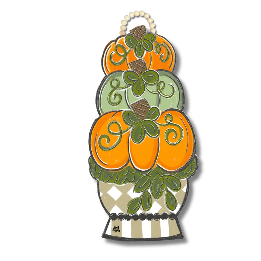 Decorative wall hanging with stacked pumpkins on a white background