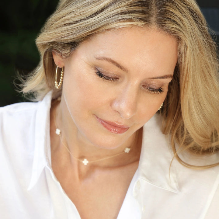 14kt gold-filled chain and our signature cross SPACED EVENLY APART AROUND NECKLACE ON MODEL