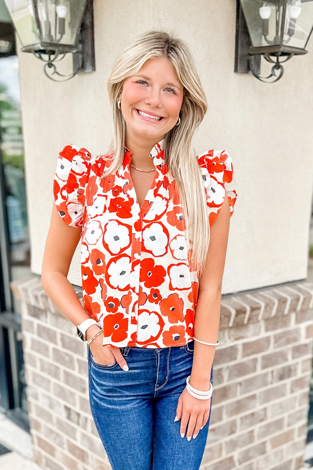 red and white floral blouse