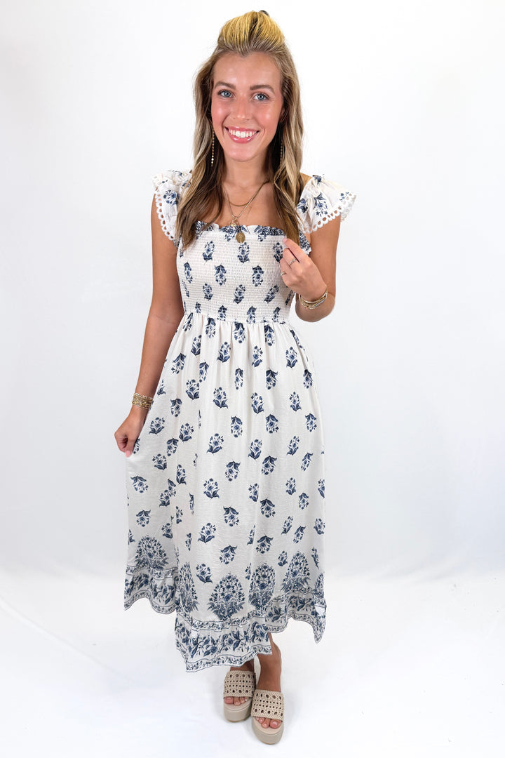 NAVY BLOCK PRINT SMOCKED RUFFLE SHOULDER MIDI DRESS