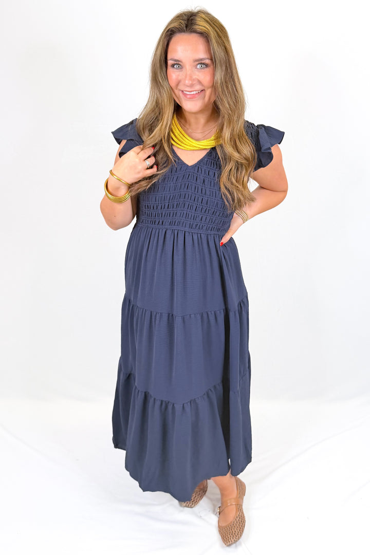NAVY SMOCKED FLUTTER SLEEVE MIDI DRESS