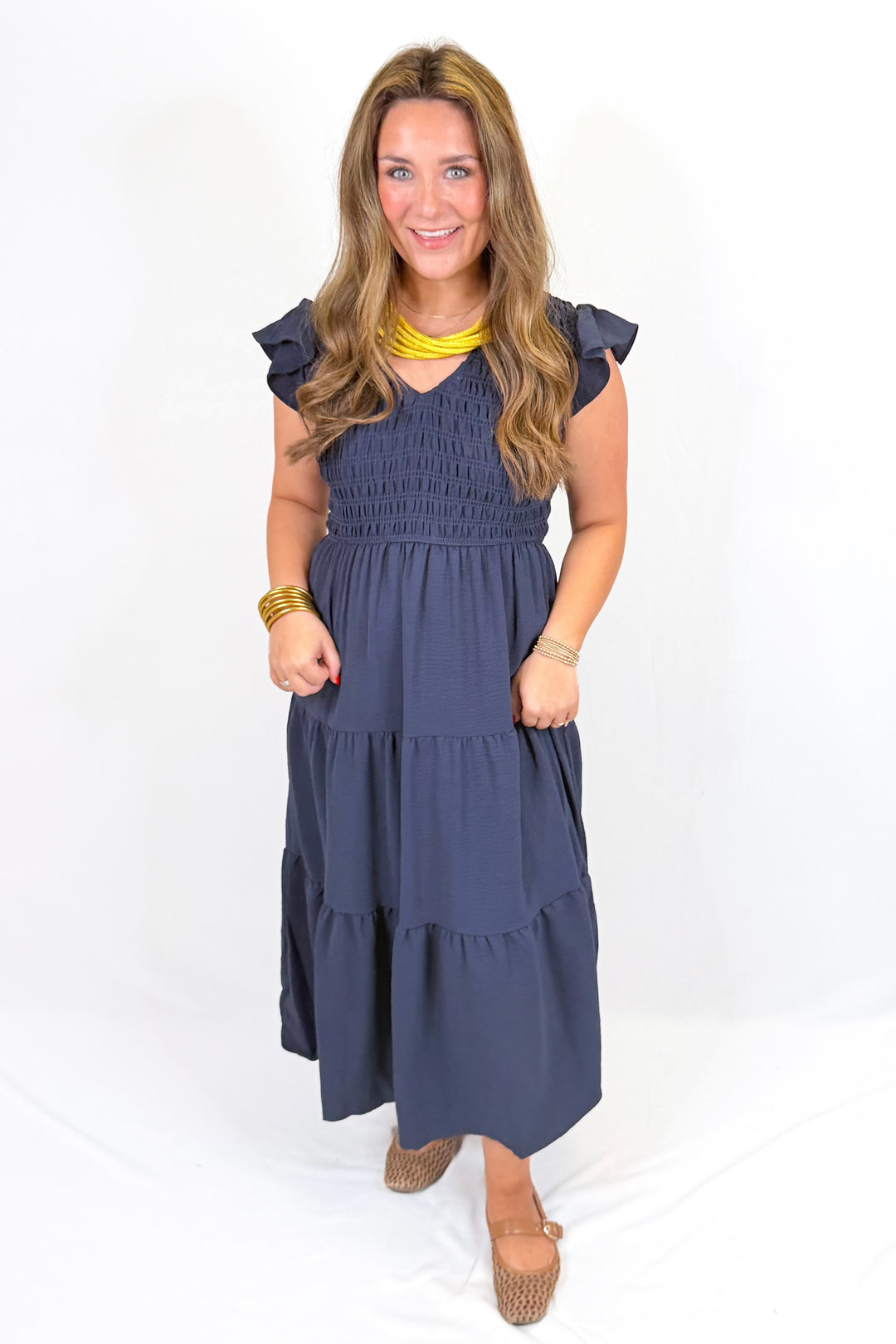 NAVY SMOCKED FLUTTER SLEEVE MIDI DRESS