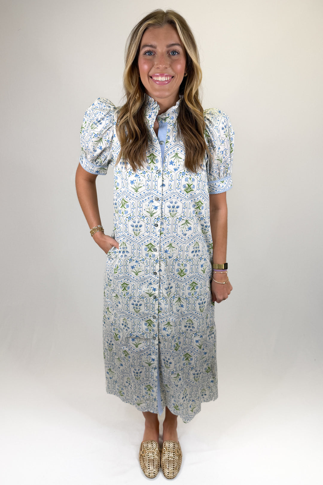 Blue and green floral tile print midi dress with puff sleeves, ruffle collar, and button-front detail