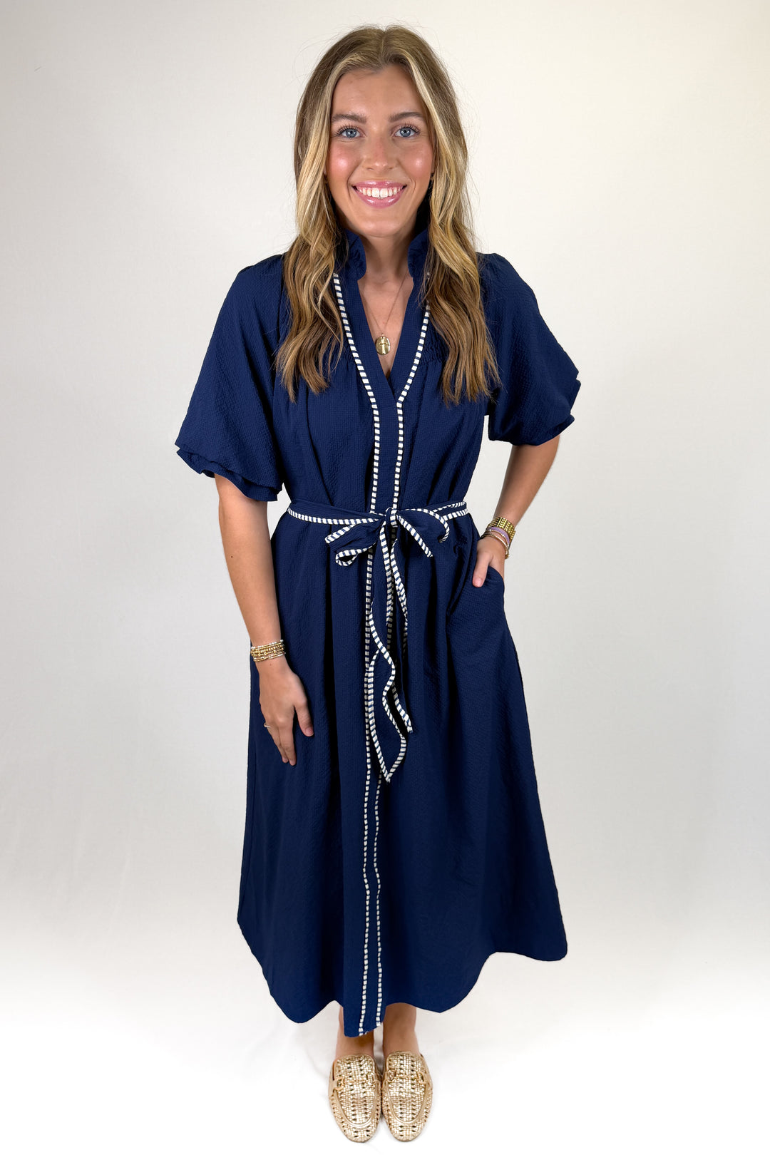 Navy midi dress with white contrast trim and tie waist belt, short sleeve classic coastal style dress with pockets and stand collar
