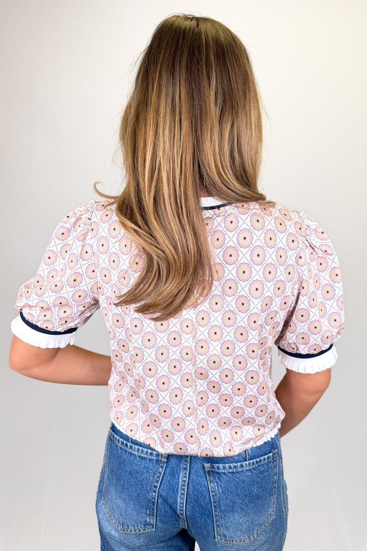 Boutique women’s pink and cream floral print blouse with puff sleeves, contrast neckline, and lightweight fabric