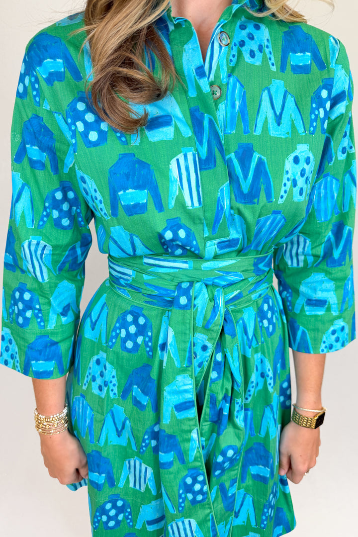 Boutique women’s green and blue patterned shirt dress with collared neckline, button front, and adjustable waist tie