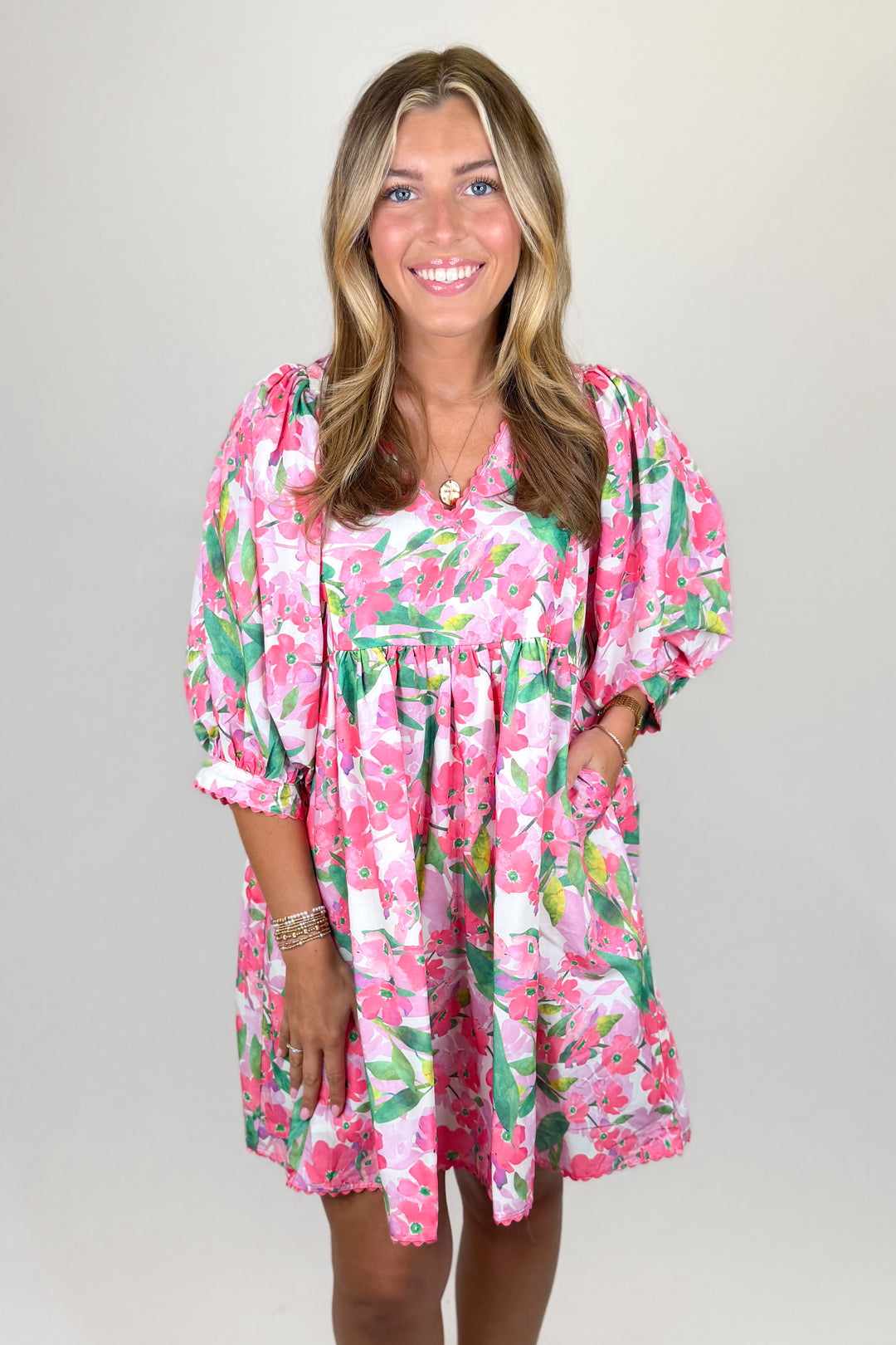 Pink floral mini dress for women with puff sleeves and flowy silhouette boutique spring outfit