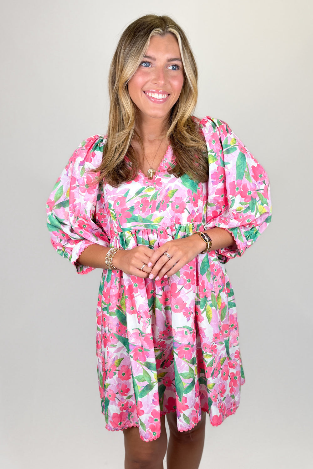 Pink floral mini dress for women with puff sleeves and flowy silhouette boutique spring outfit