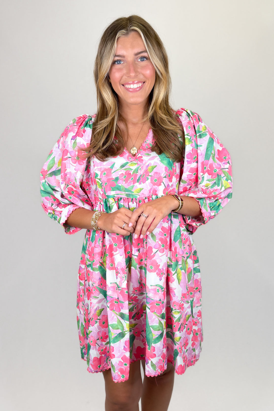 Pink floral mini dress for women with puff sleeves and flowy silhouette boutique spring outfit