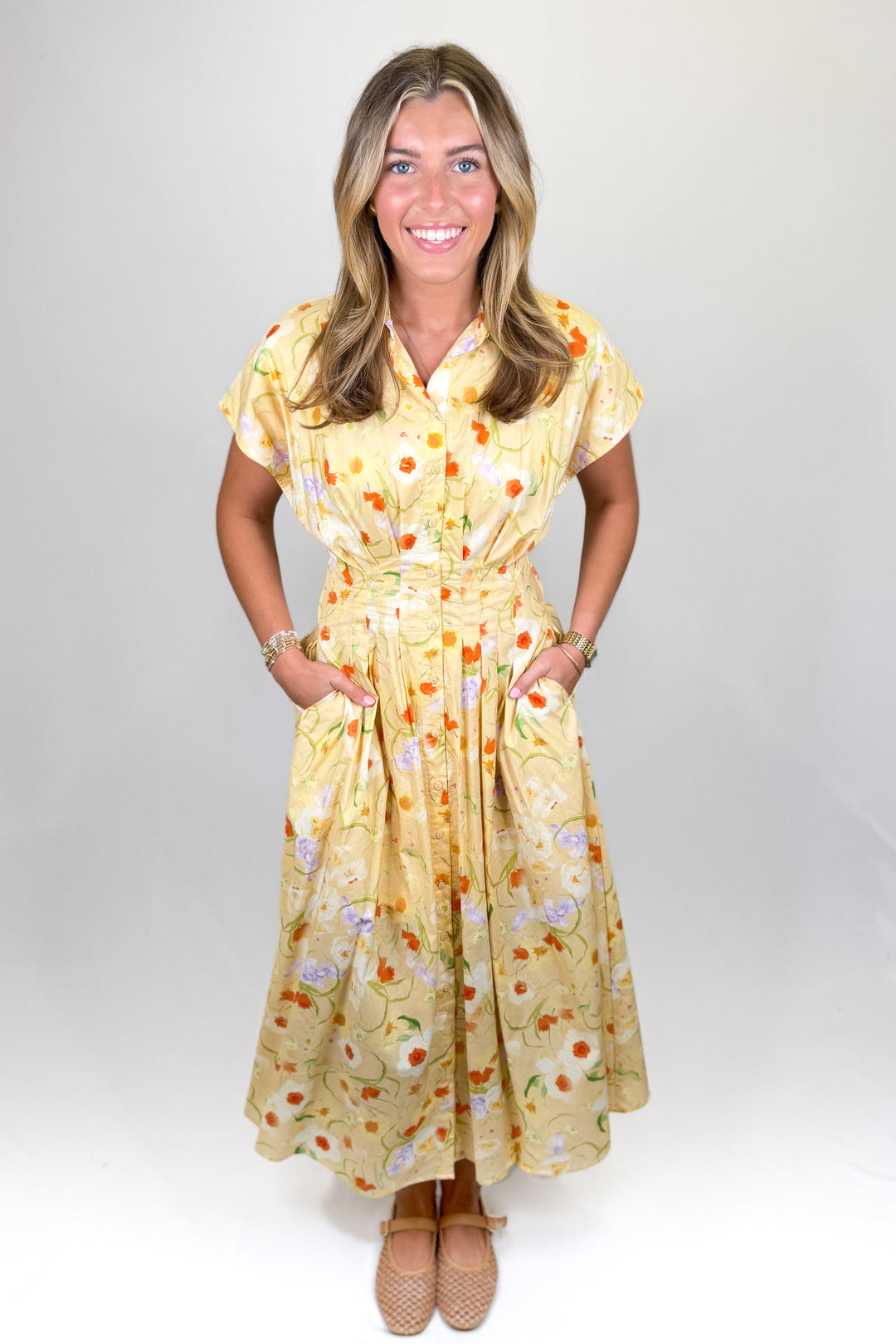 Yellow floral midi dress for women with button front and cinched waist boutique spring outfit