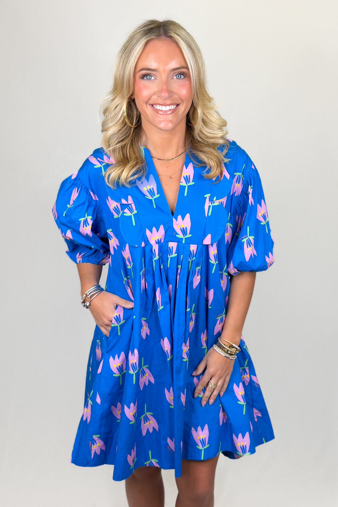 Blue floral mini dress for women with puff sleeves and flowy silhouette boutique spring outfit