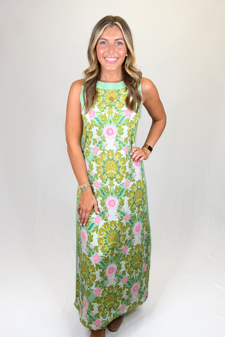 Green and pink floral print maxi dress with sleeveless design, high neckline, and straight silhouette, featuring a lightweight feel and classic fit