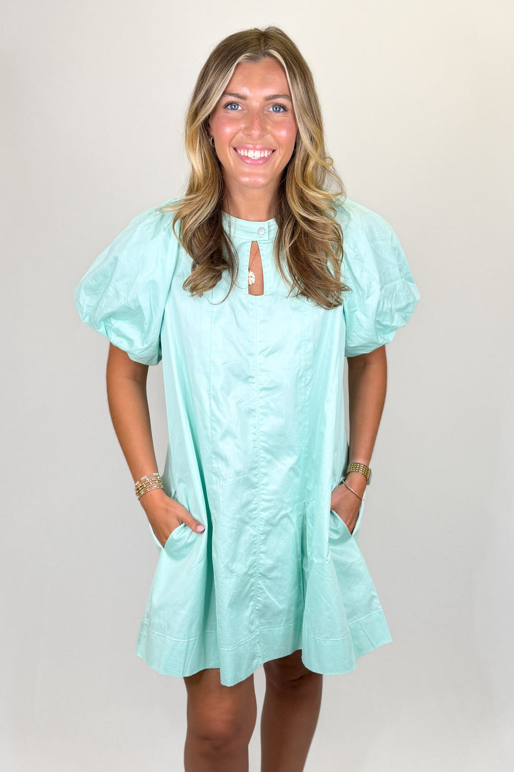 Mint green puff sleeve mini dress with keyhole neckline and flowy fit