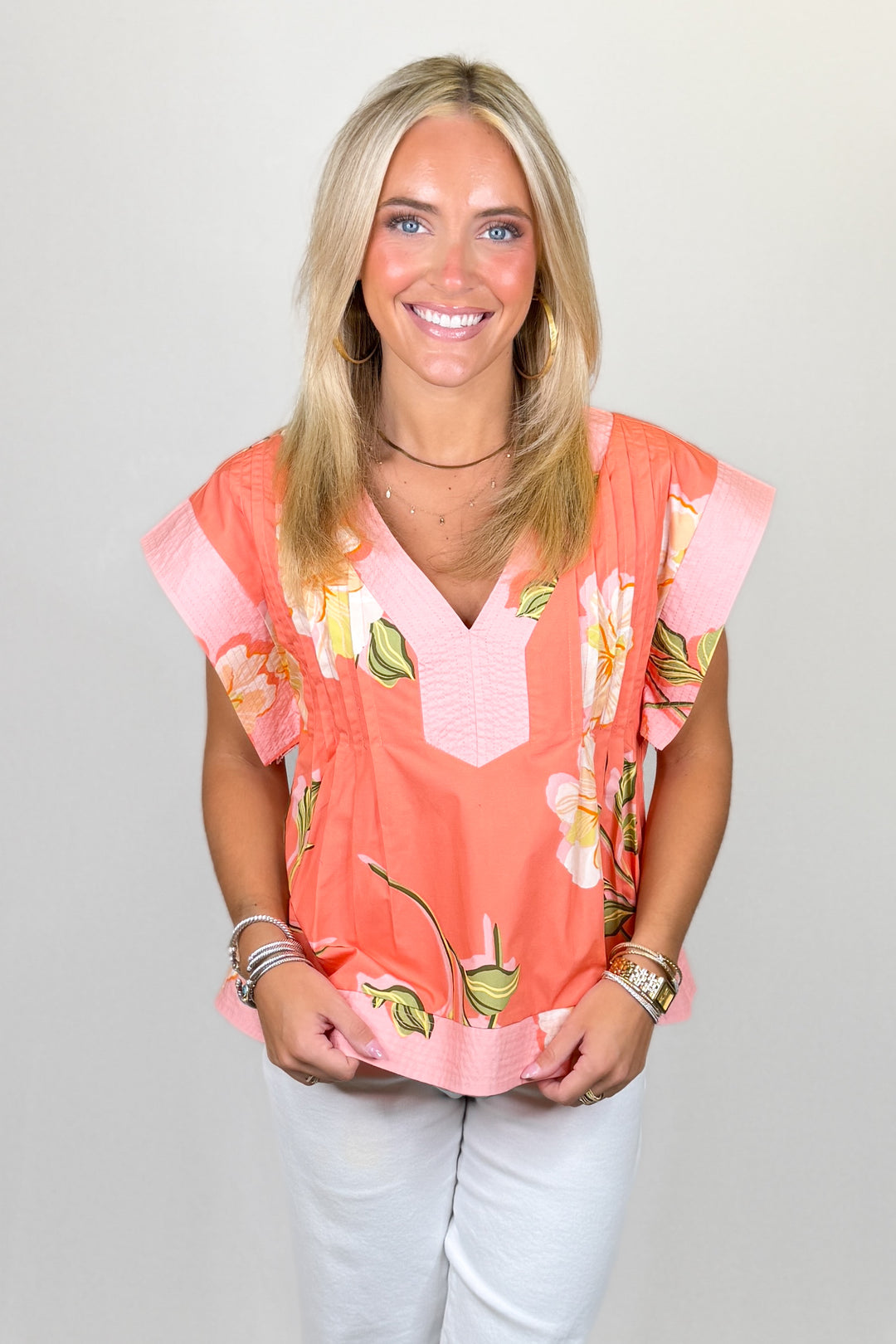 Coral floral blouse with pleated detail and v-neck short sleeve top | Walker Boutique