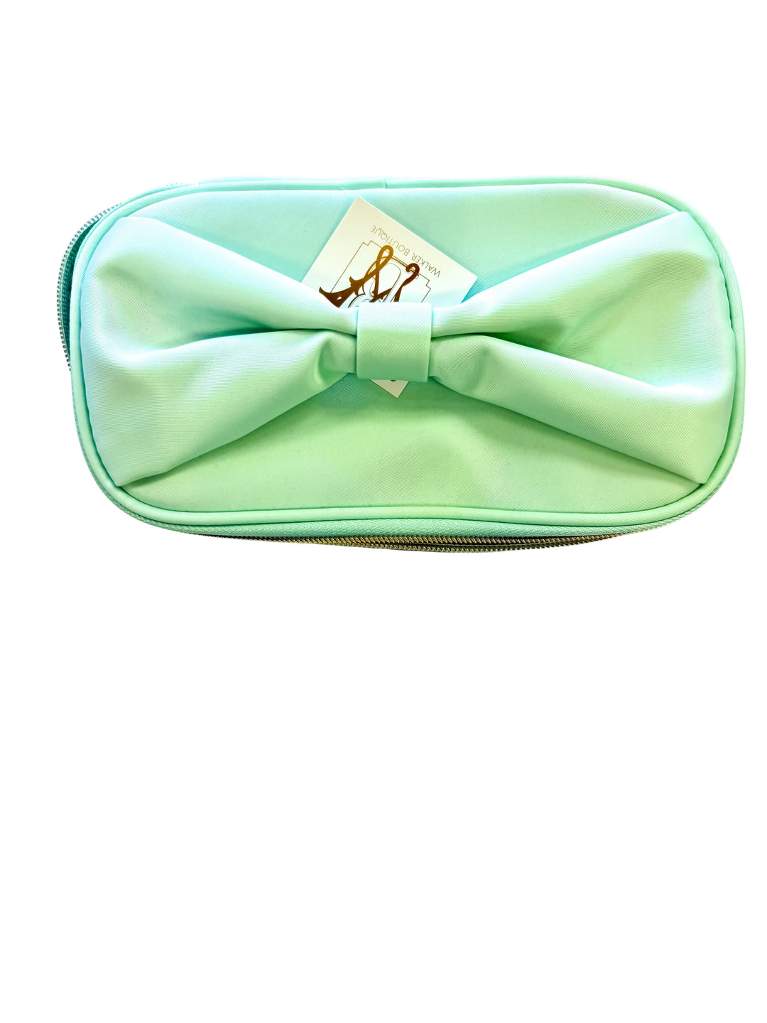 Front view of mint cosmetic bag featuring a large fabric bow and gold zipper.
