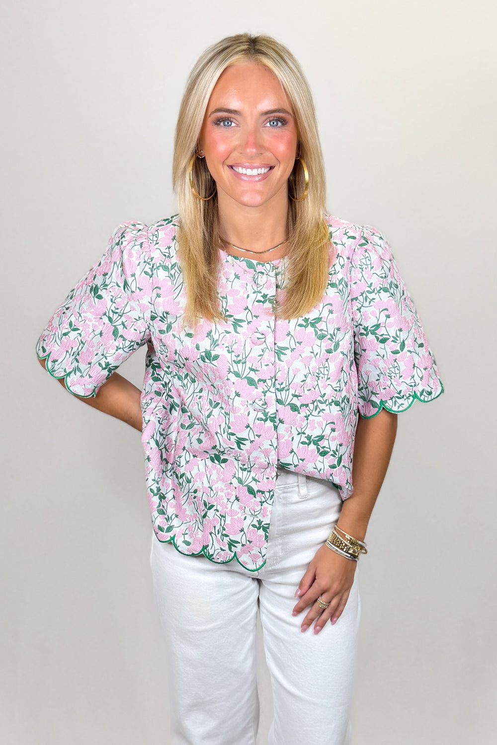 Pink floral blouse with green trim and scalloped hem short sleeve top | Walker Boutique