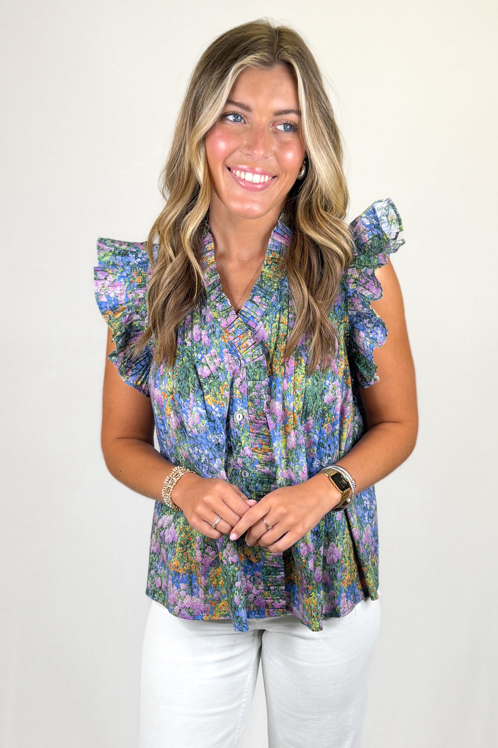 Multicolor floral sleeveless blouse with ruffle collar and flutter sleeves, lightweight women’s boutique top