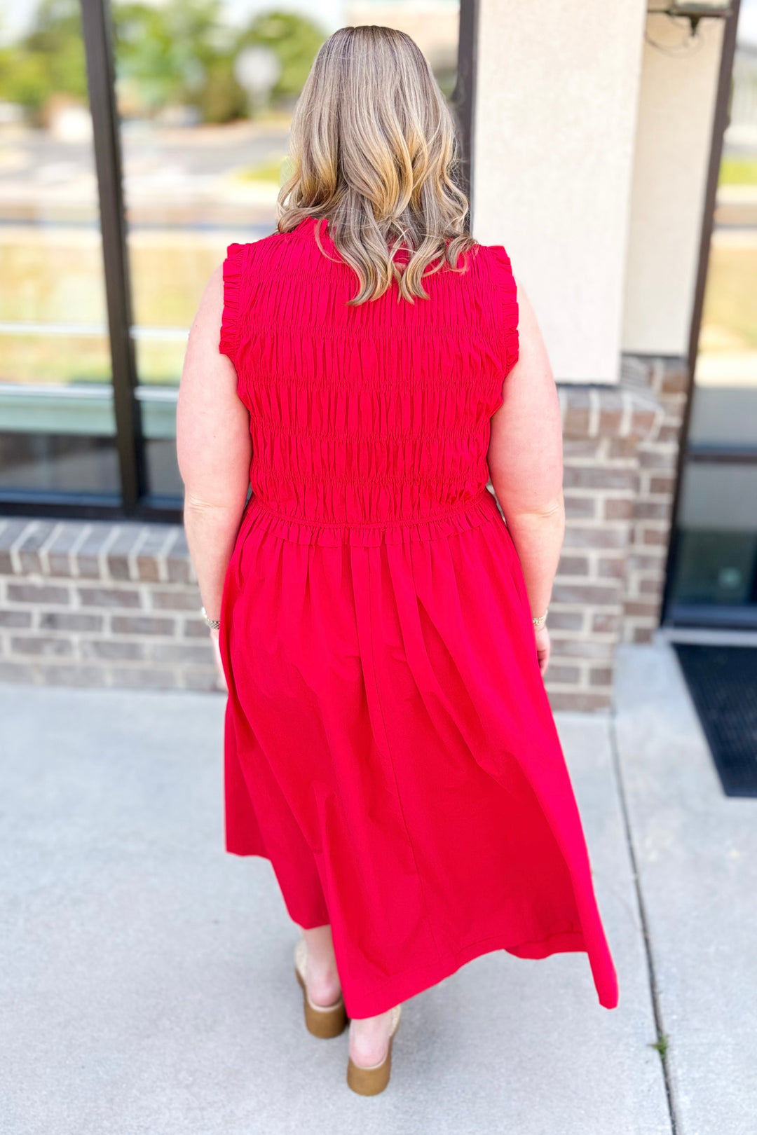 RED SLEEVELESS SMOCKED TIE FRONT MIDI DRESS
