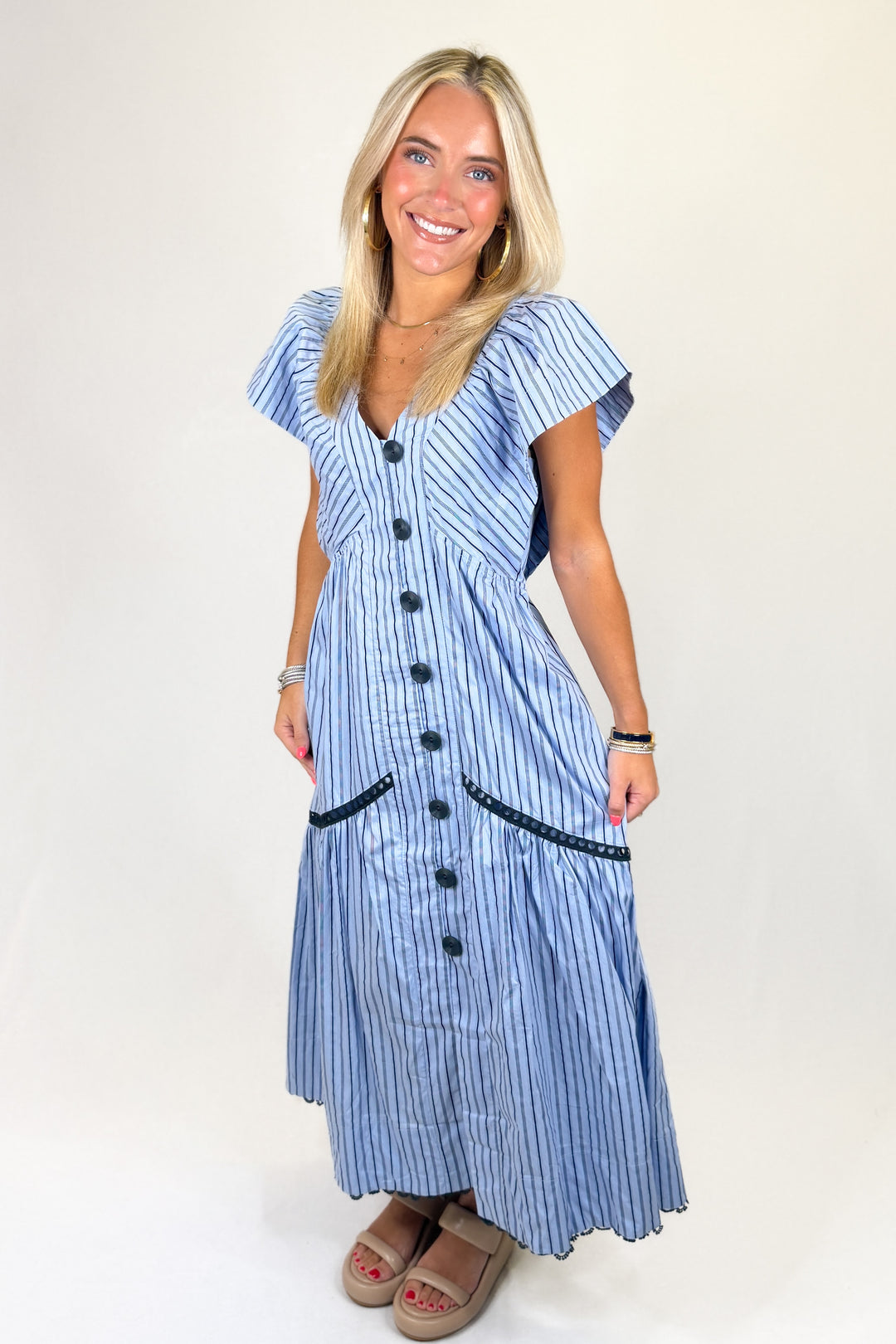 Blue striped button front midi dress with flutter sleeves and pockets, lightweight casual summer dress for women