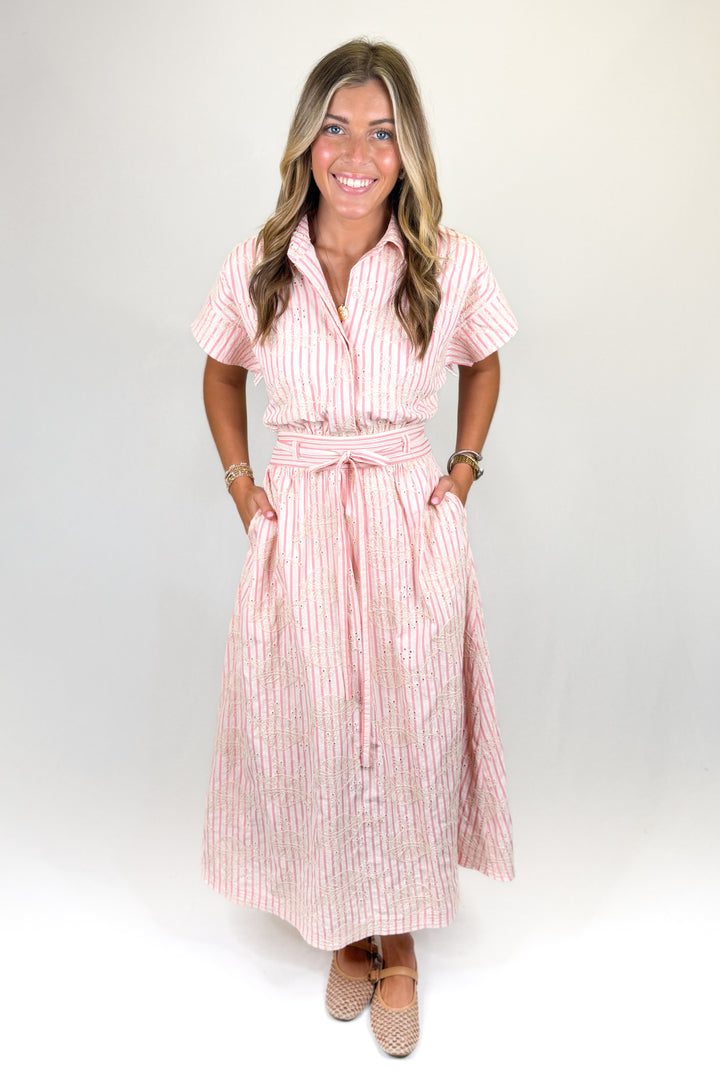 Pink striped midi shirt dress with short sleeves, button front, tie waist, and pockets, classic women’s dress