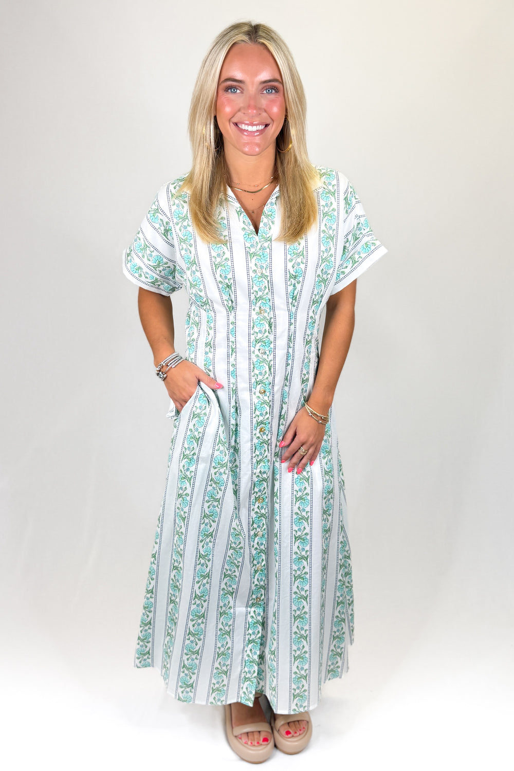 Green and white floral striped maxi dress with short sleeves and relaxed fit