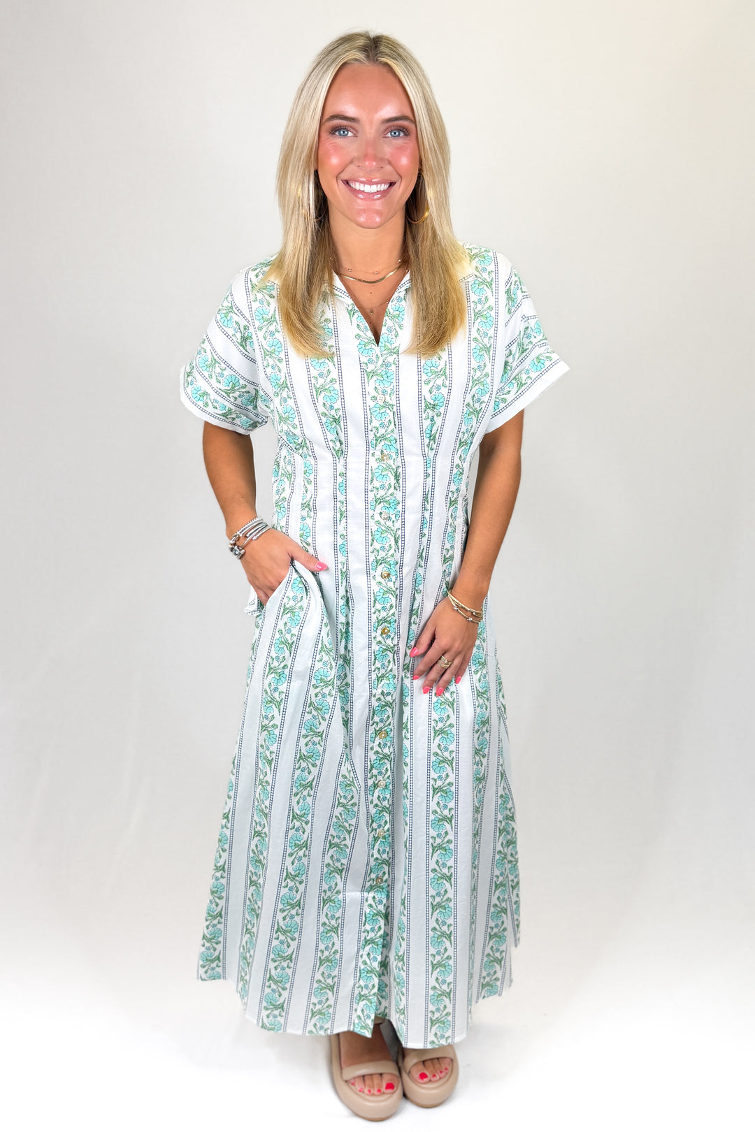 Green and white floral striped maxi dress with short sleeves and relaxed fit