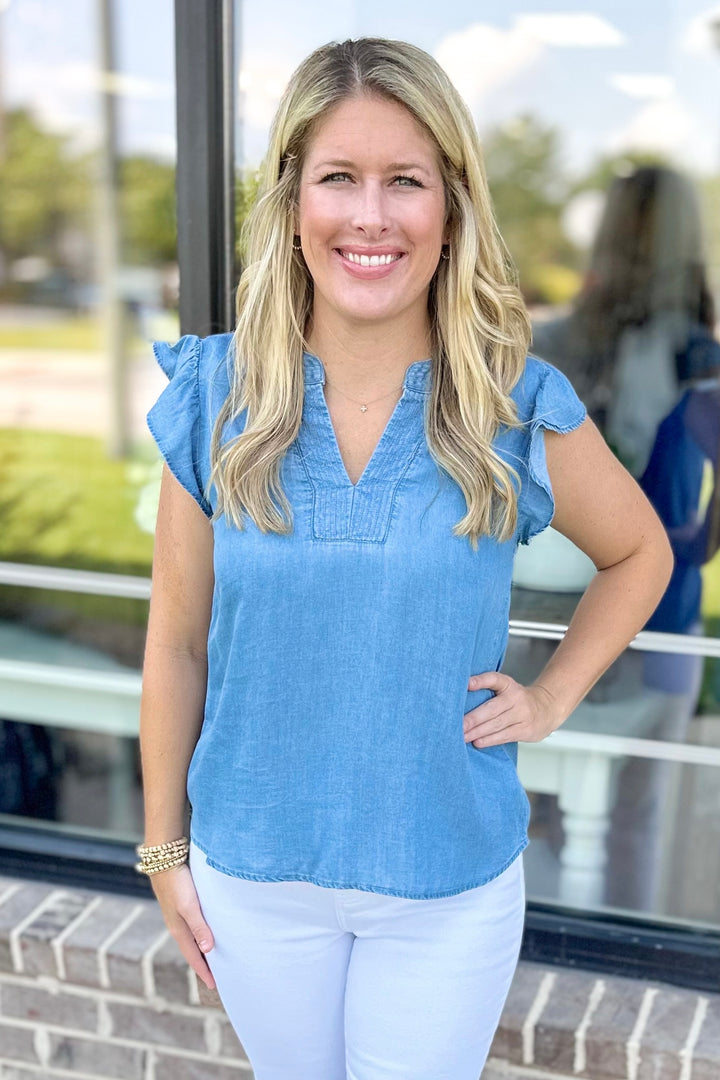 CHAMBRAY RUFFLE SHOULDER VNECK TOP