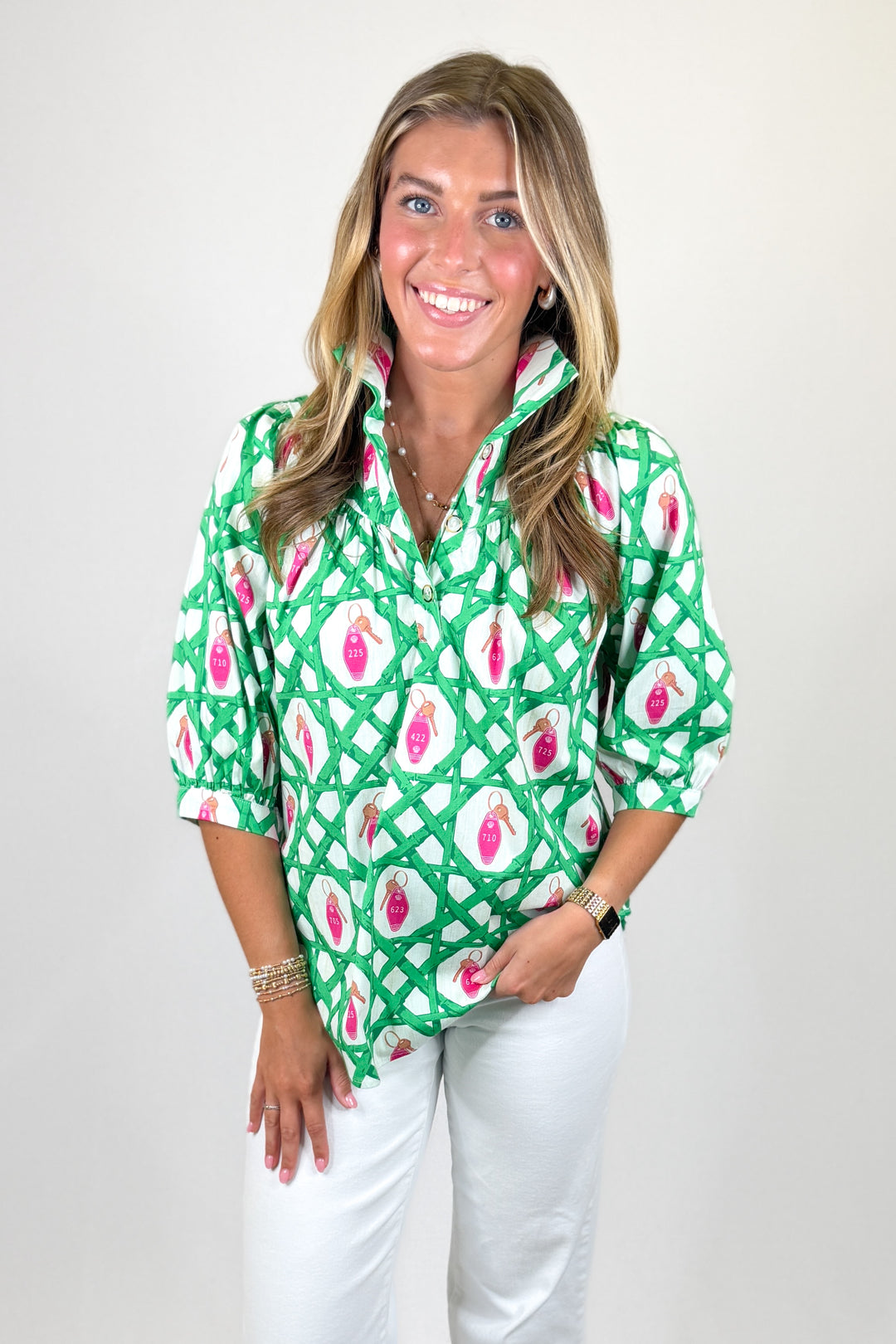 Women's green lattice print blouse with pink key details