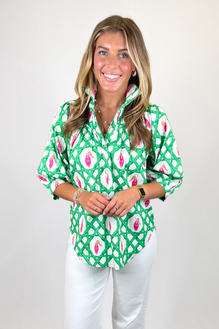 Women's green lattice print blouse with pink key details