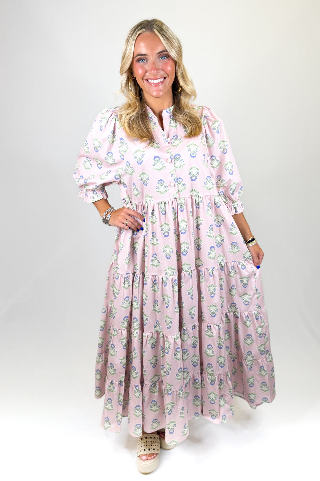 Woman wearing a floral dress on a white background