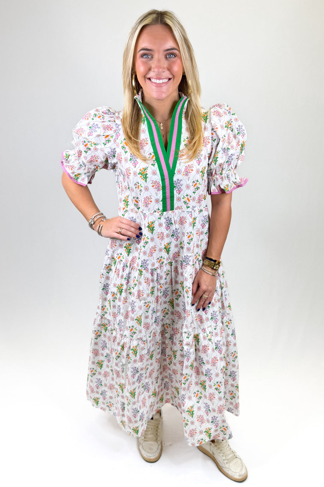 Woman wearing a floral dress with a white background