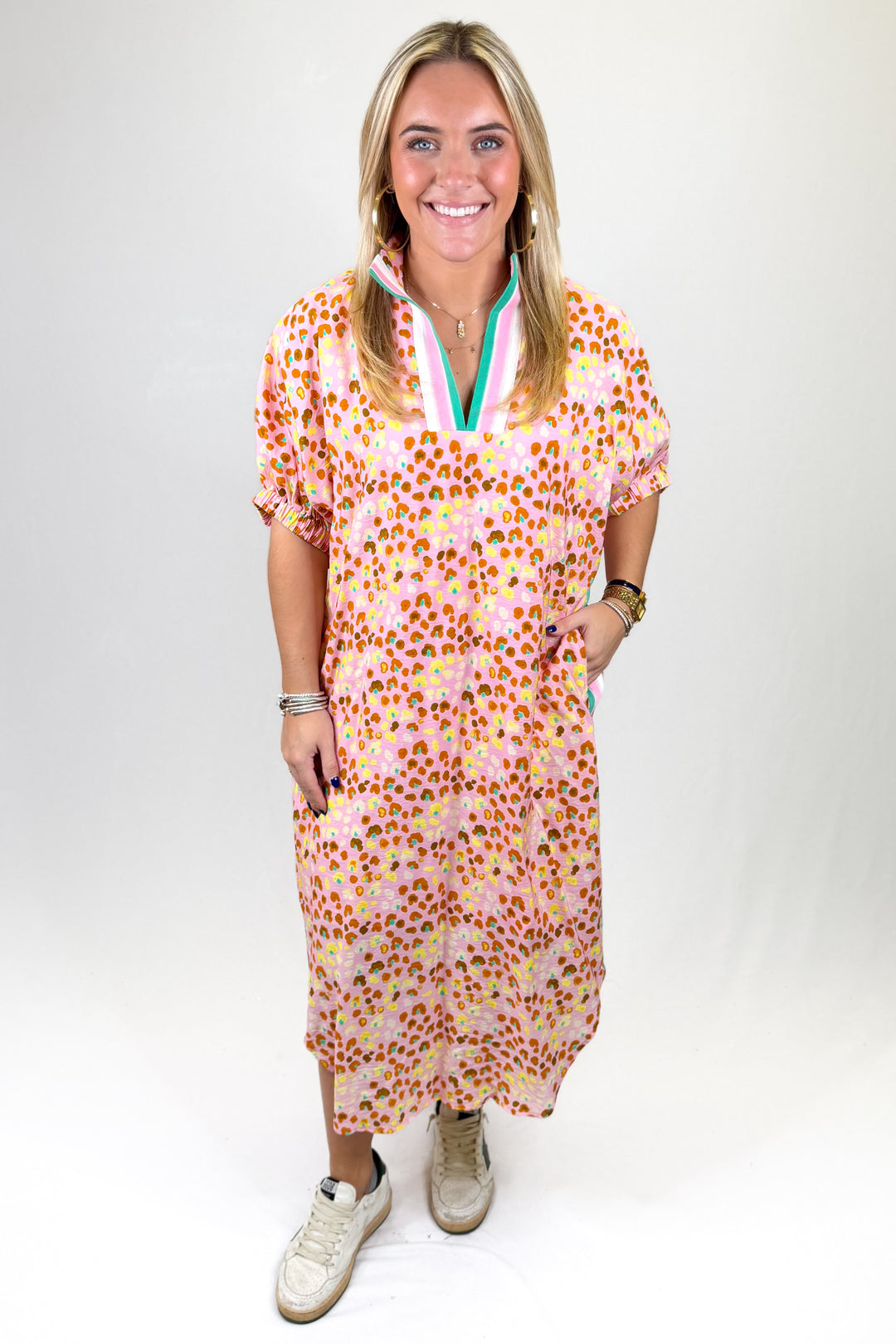 Woman wearing a floral dress with a white background