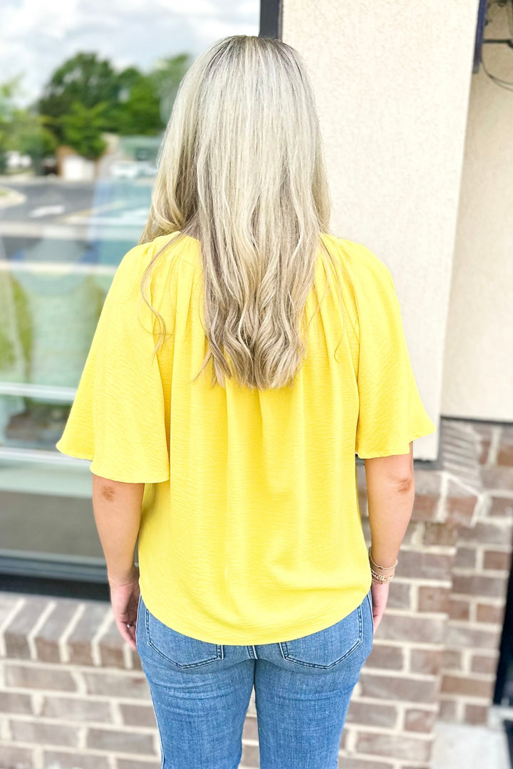 YELLOW VNECK PLACKET TOP