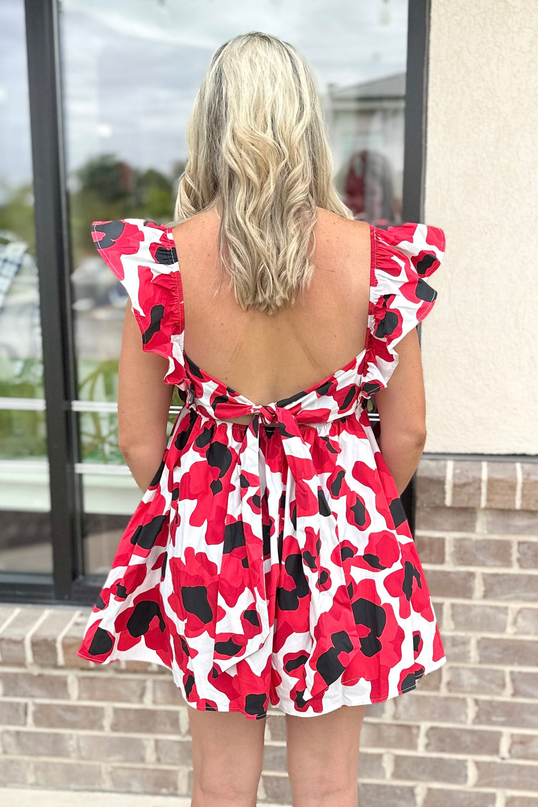 RED & BLACK LEOPARD RUFFLE TIE BACK ROMPER