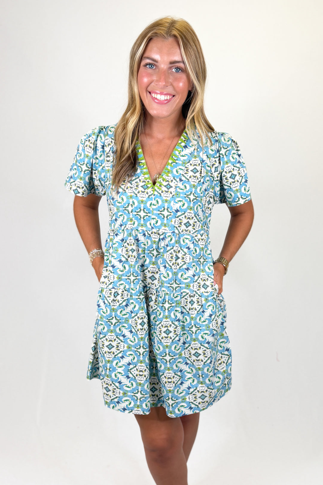 Woman wearing a floral dress with a white background