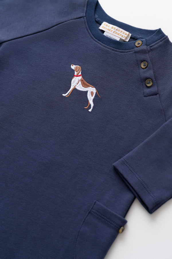 Navy blue long-sleeve shirt with embroidered dog design on a white background