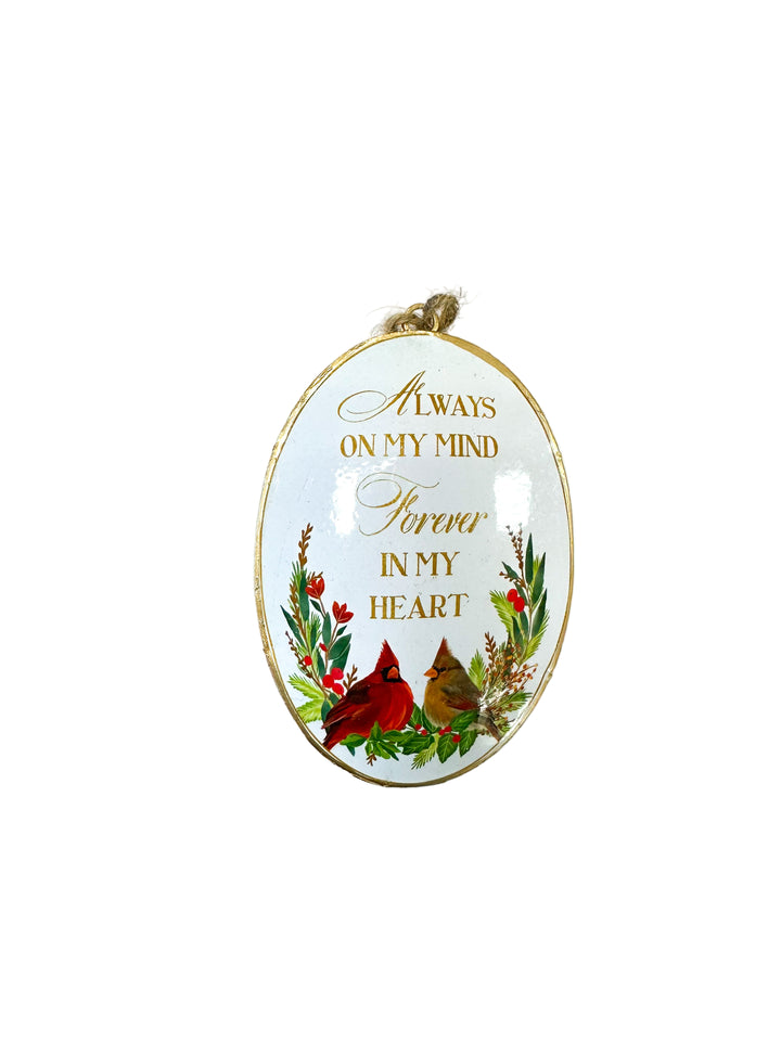 Cardinal-themed Christmas ornament with sentimental message and floral wreath.
