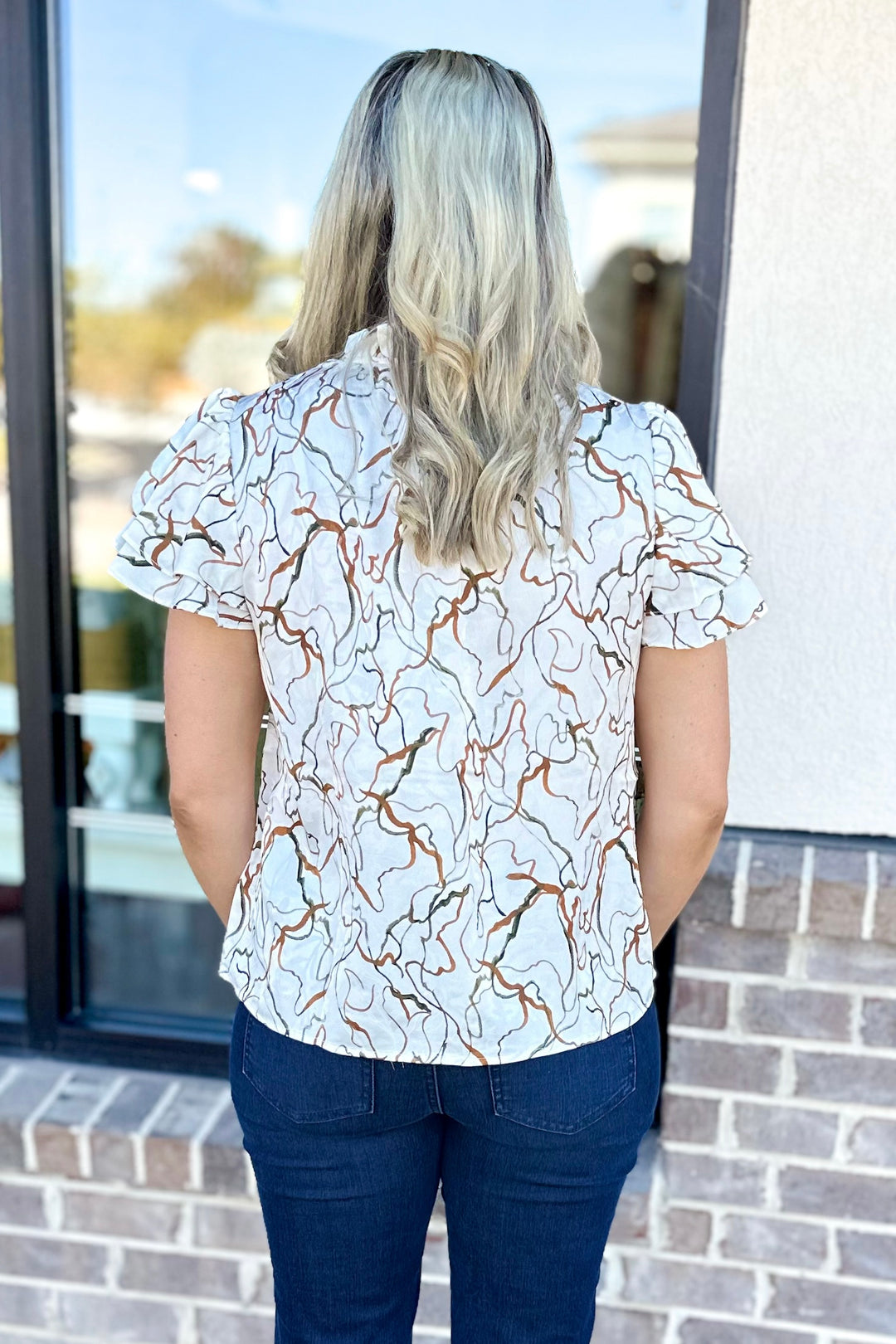 RUST & IVORY SWIRL PRINT VNECK TOP