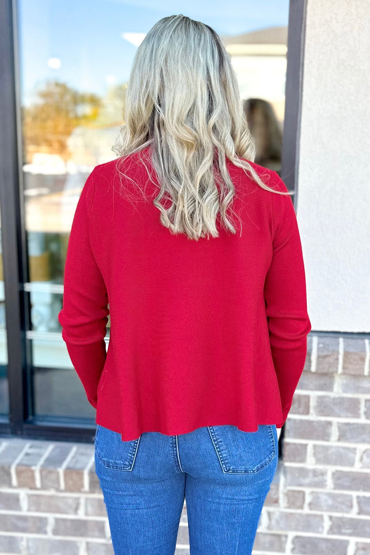 RED TURTLENECK SWING SWEATER