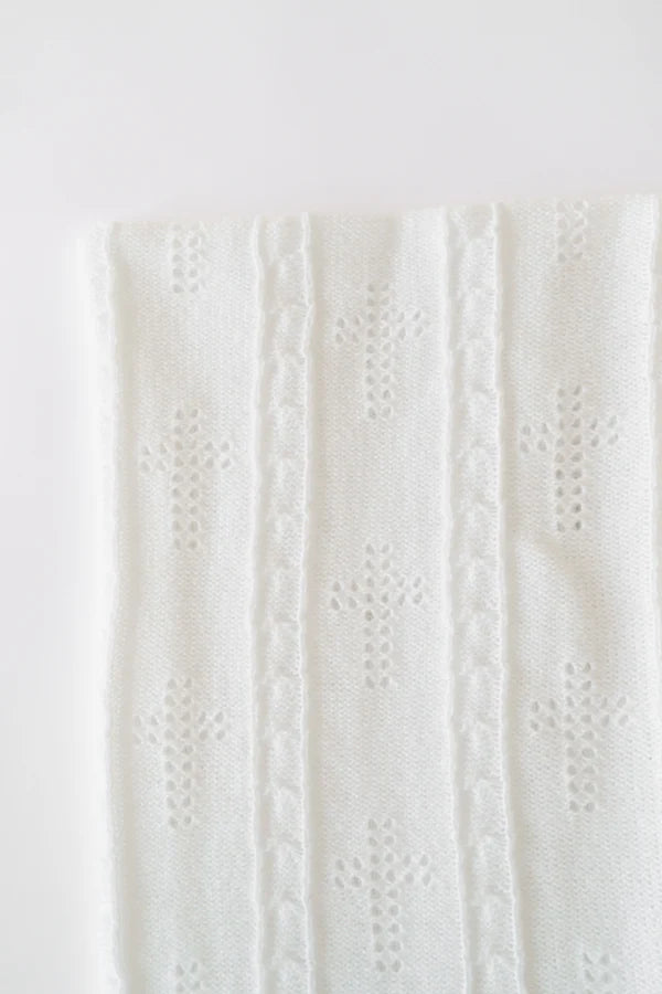 Close-up of a textured white fabric on a light gray background