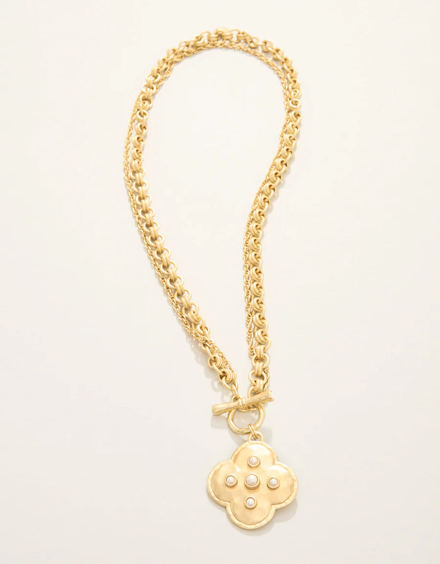gold necklace with clover pendant