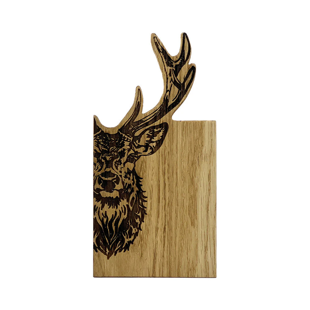 Wooden cutting board with a deer head design on a white background